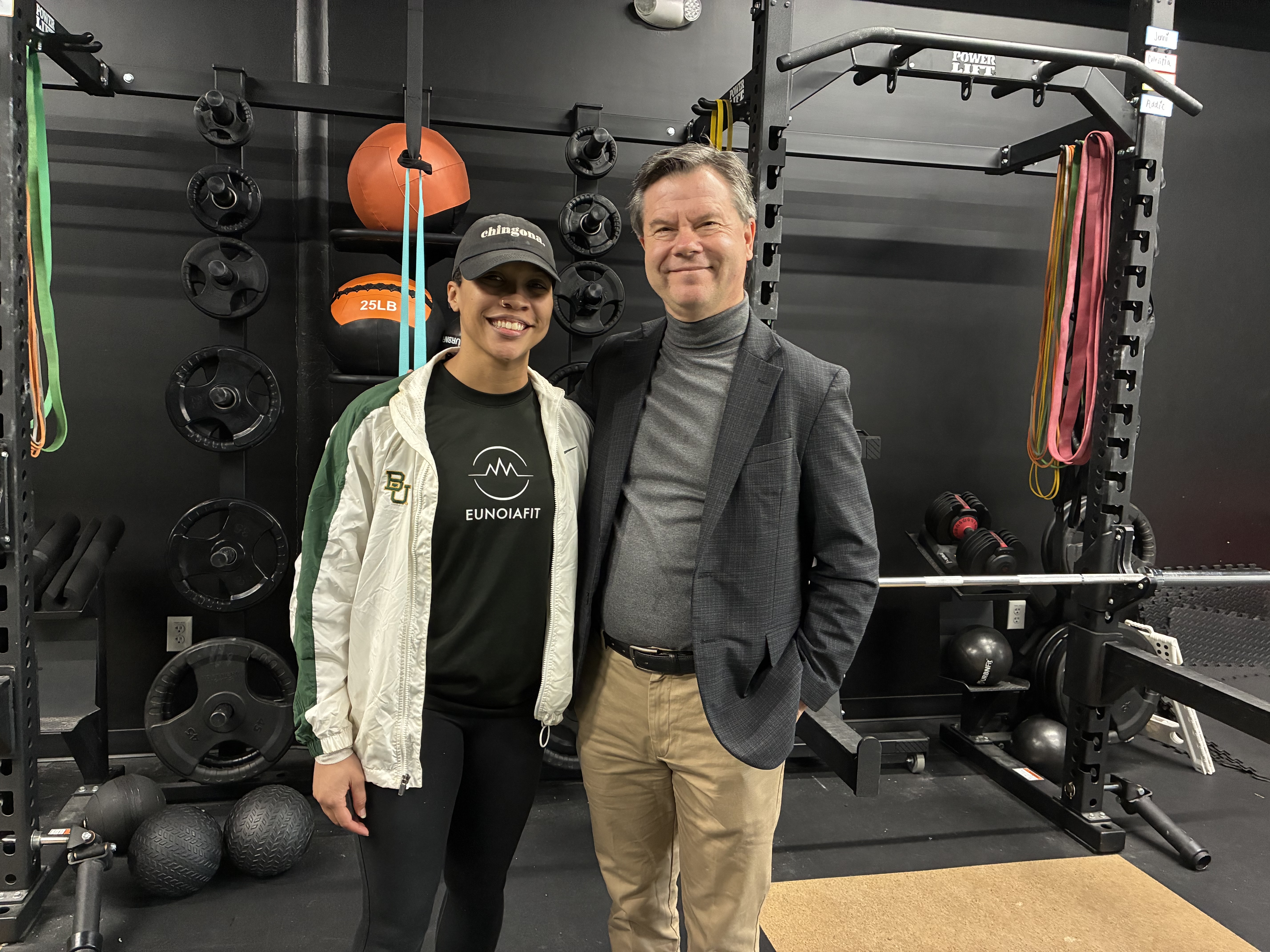 Alyssa Nichols stands with Alex Counts inside Eunoiafit