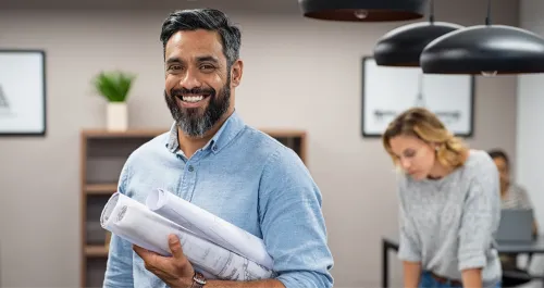 Man entrepreneur holding blueprint papers