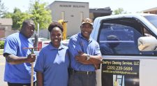 Terry Smith, owner of Smitty's Cleaning Service, with employees for vacuuming, dusting, window cleaning, in Tuscaloosa, Alabama.